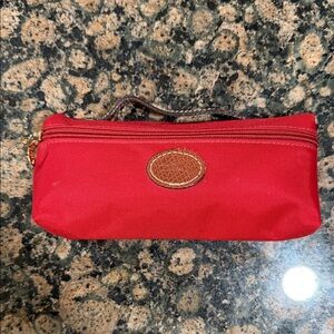 Long champ red nylon mini bag.
